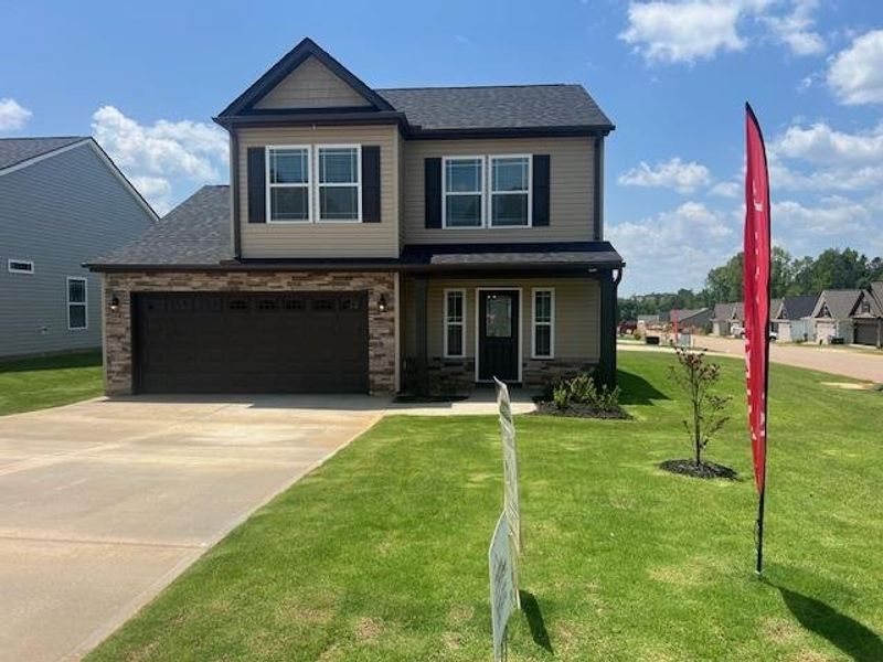 Front exterior of a new home in Cleveland Meadows, Spartanburg, SC, highlighting curb appeal (Image 1).
