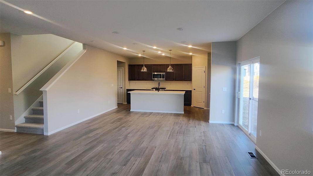 Spacious, unfurnished interior of a new home in The Cottages Collection at Ridgeline Vista, Brighton (Image 5).