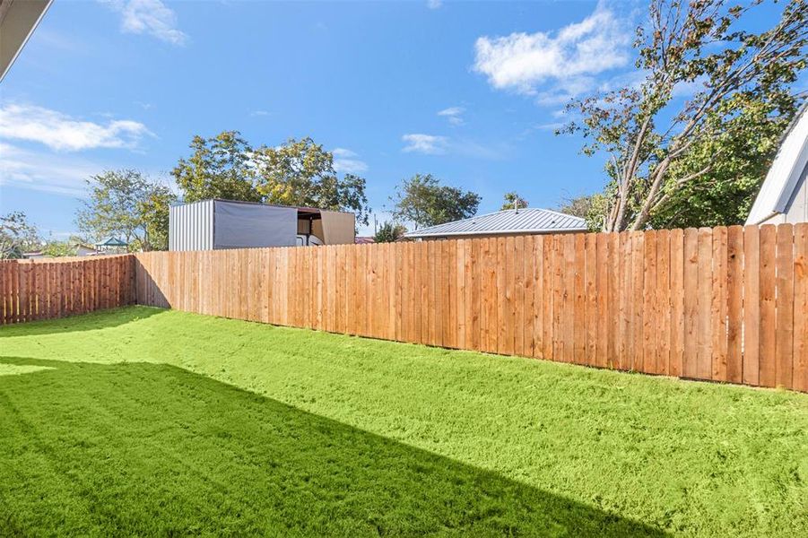 View of fenced backyard