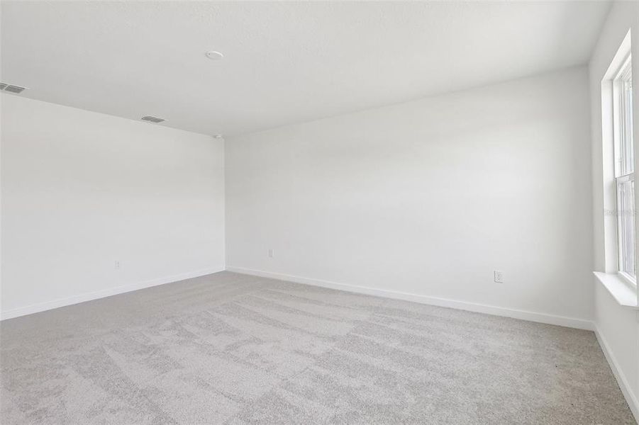 Spacious, unfurnished interior of a new home in Grasslands West, Lakeland (Image 33).