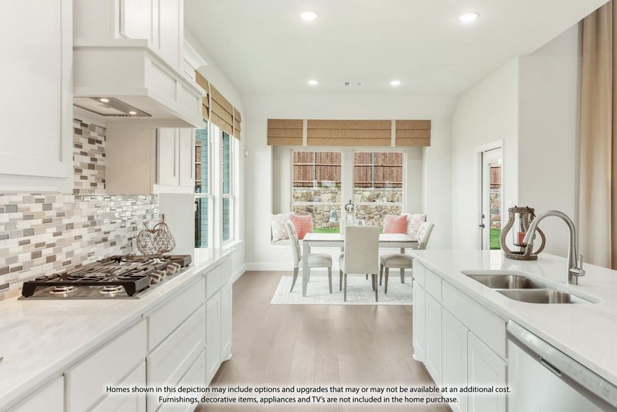 Kitchen with white cabinets, tile backsplash, gas cooktop, and breakfast nook with large windows Kitchen with white cabinets, tile backsplash, gas cooktop, and breakfast nook with large windows