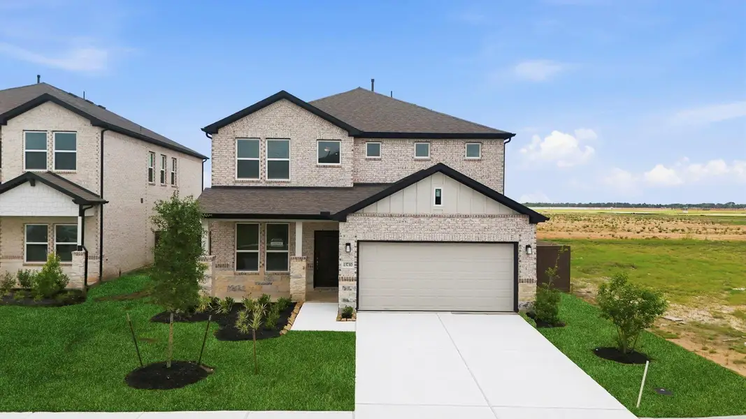 Front exterior of a new home in , Iowa Colony, TX, highlighting curb appeal (Image 25).