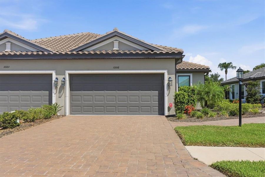 Front exterior of a new home in , Sarasota, FL, highlighting curb appeal (Image 1). Front exterior of a new home in , Sarasota, FL, highlighting curb appeal (Image 1).