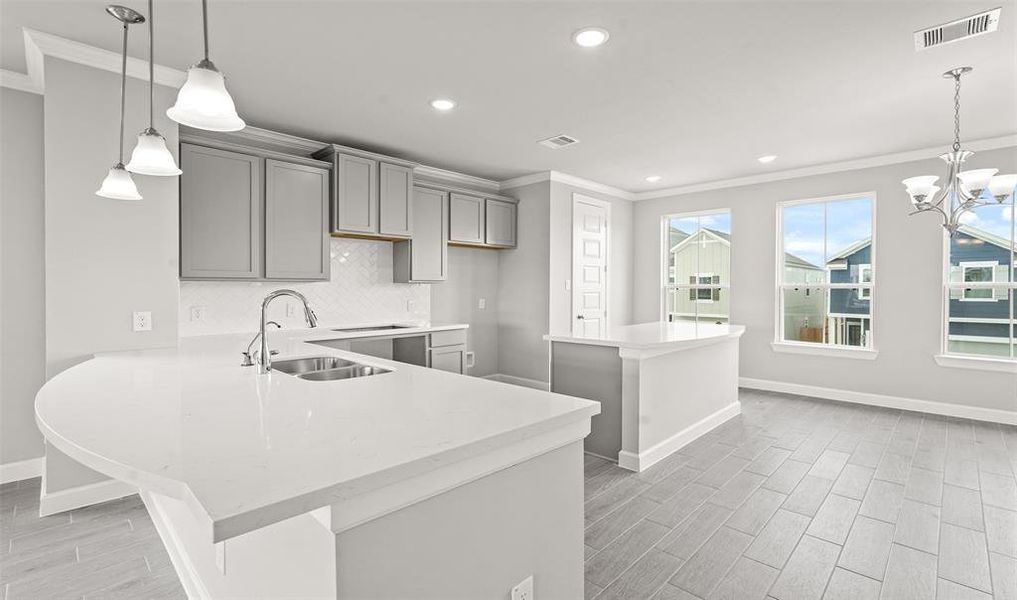 Kitchen with island (*Photo not of actual home and used for illustration purposes only.)