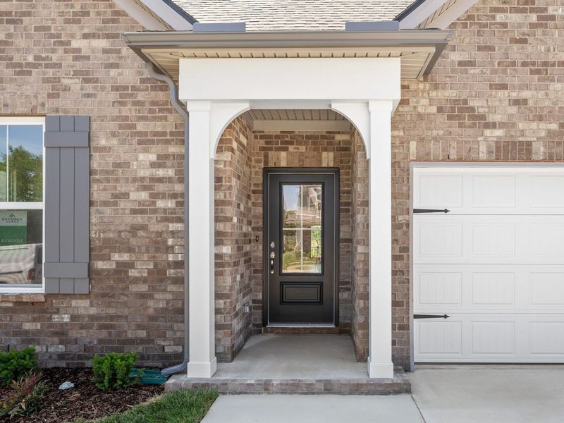 Exterior details and patio area of a home in Woods Crossing, Gallatin (Image 3).
