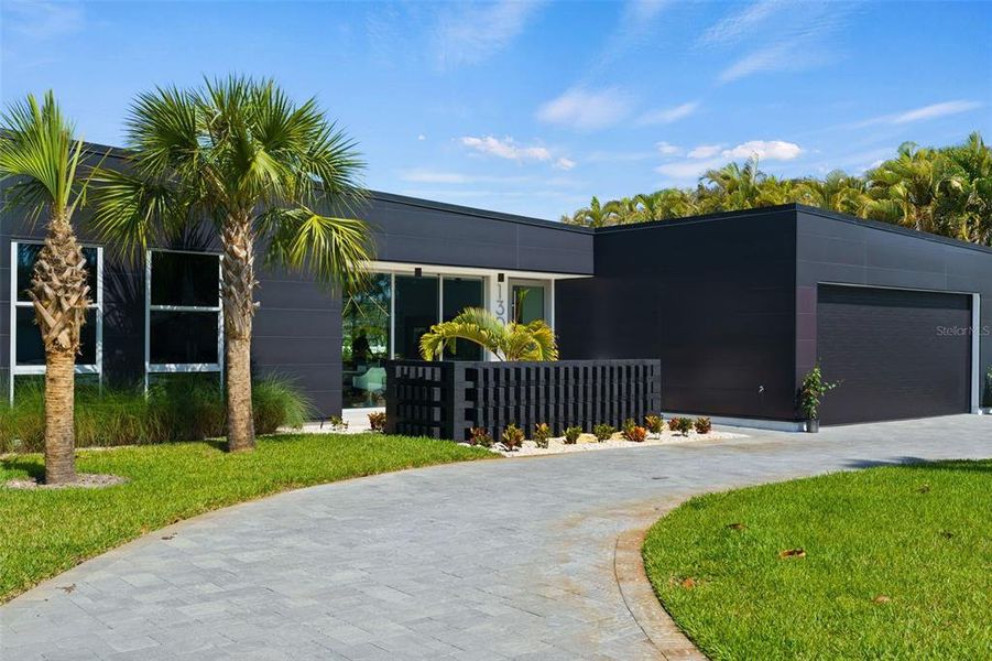 Front exterior of a new home in , Belleair, FL, highlighting curb appeal (Image 25).