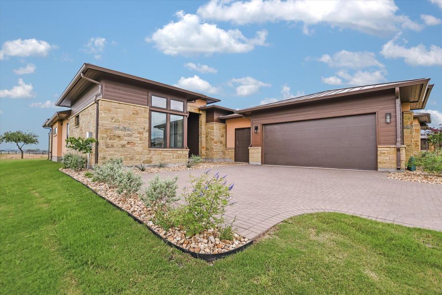 Front exterior of a home in the Lakecliff on Lake Travis community, located in Spicewood, TX (Image 18).