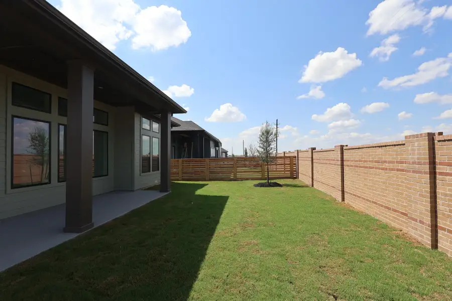 Exterior details and patio area of a home in Bridgeland Central: Emerald Heights - Enclave Collection, Cypress (Image 3).