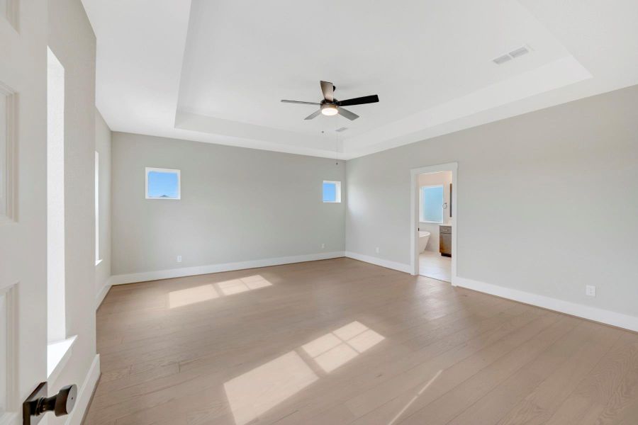 Spacious, unfurnished interior of a new home in Easthaven at Bridgeland Central - Vision Collection, Cypress (Image 23).