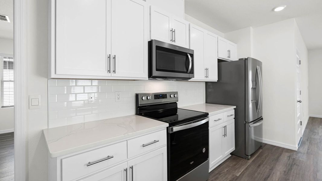 Representative furnished interior of a home built from the ASTOR by D.R. Horton in Harmony at Lake Eloise, Winter Haven (Image 5).
