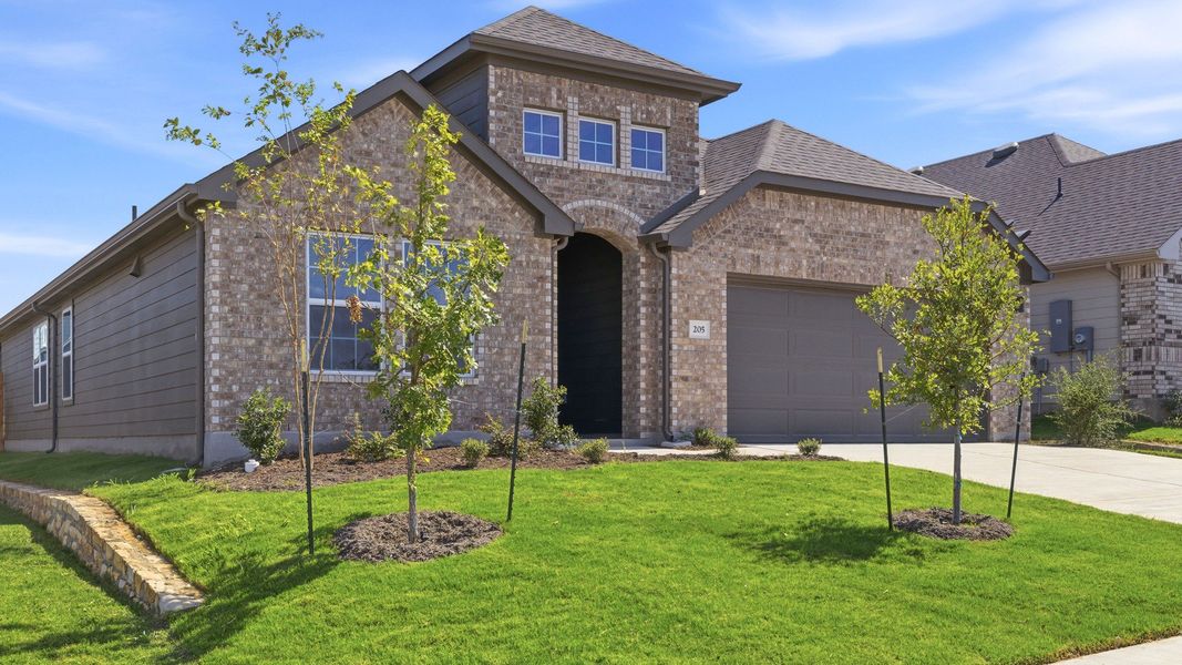 Front exterior of a new home in Hunters Glen, Jarrell, TX, highlighting curb appeal (Image 22). Front exterior of a new home in Hunters Glen, Jarrell, TX, highlighting curb appeal (Image 22).