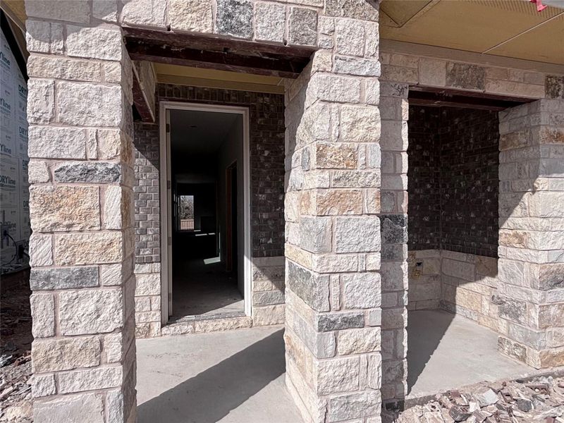 Exterior details and patio area of a home in The Colony, Bastrop (Image 4).