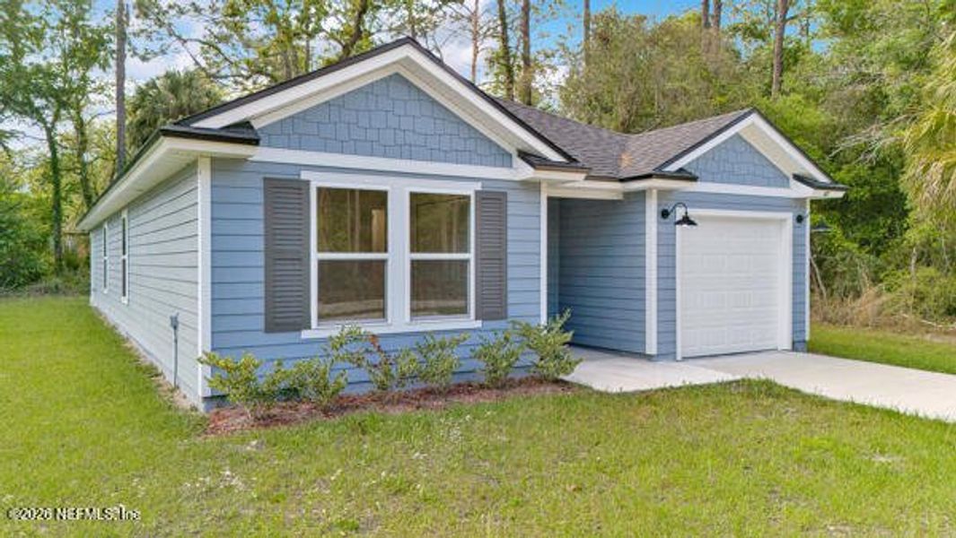 Front exterior of a new home in , Satsuma, FL, highlighting curb appeal (Image 30).