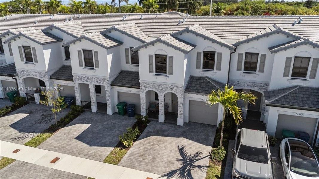 Front exterior of a new home in , Homestead, FL, highlighting curb appeal (Image 20).
