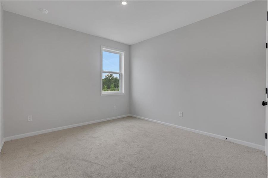 Spacious, unfurnished interior of a new home in The Paddocks at Doc Hughes, Buford (Image 19).
