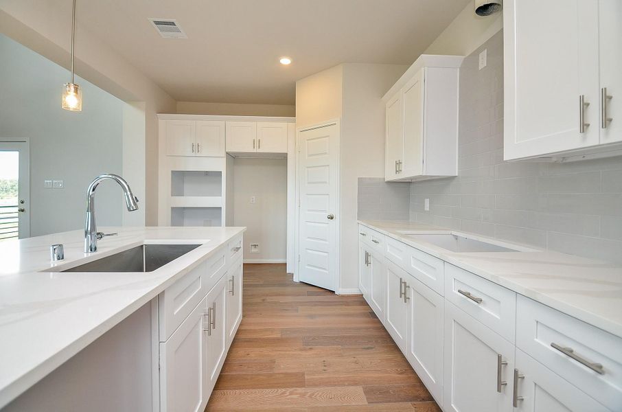 Step into this gorgeous kitchen. The crisp, white cabinetry gives a clean look and offers plenty of storage room. Step into this gorgeous kitchen. The crisp, white cabinetry gives a clean look and offers plenty of storage room.