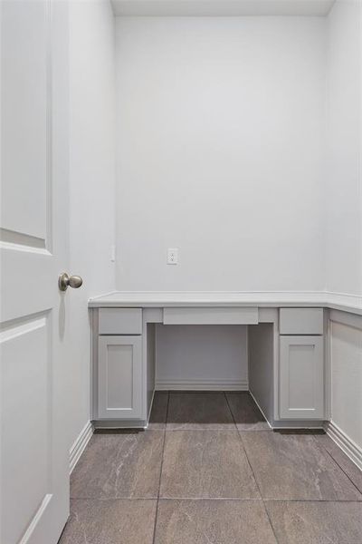 Unfurnished office with built in desk