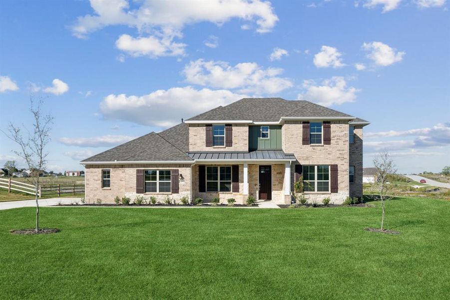 View of front of house featuring covered porch and a front yard