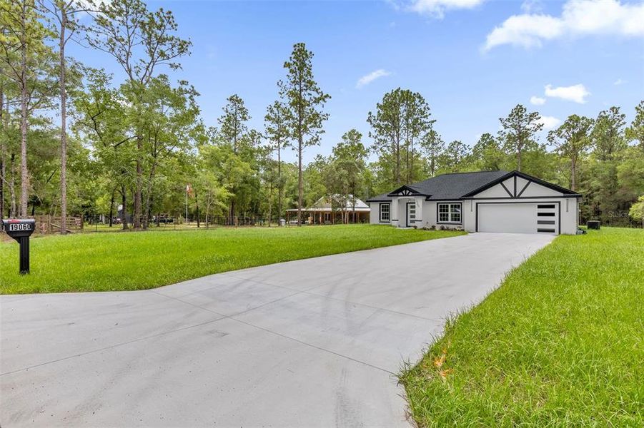 Front exterior of a new home in , Dunnellon, FL, highlighting curb appeal (Image 19).