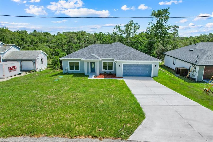 Front exterior of a new home in , Deltona, FL, highlighting curb appeal (Image 23).