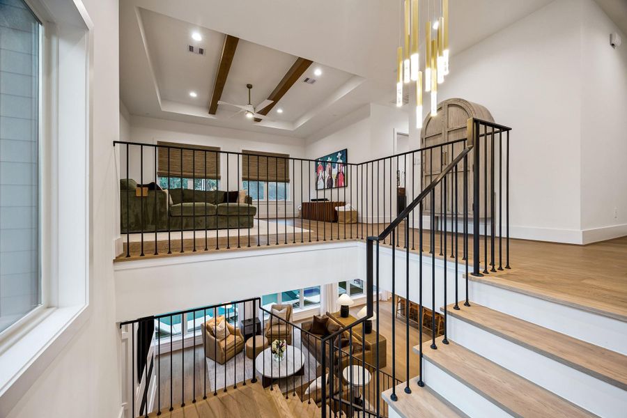 This view from the stair landing beautifully illustrates the home’s open, inviting design and seamless flow between spaces.