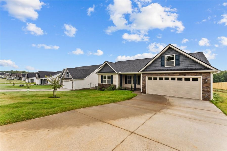 Representative exterior photo of a completed home built from the Startex by Enchanted Homes in Huckleberry Cove, Chesnee, SC (Image 20). Representative exterior photo of a completed home built from the Startex by Enchanted Homes in Huckleberry Cove, Chesnee, SC (Image 20).