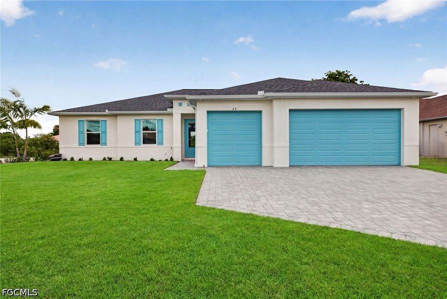 Front exterior of a new home in Cape Coral, Cape Coral, FL, highlighting curb appeal (Image 2). Front exterior of a new home in Cape Coral, Cape Coral, FL, highlighting curb appeal (Image 2).