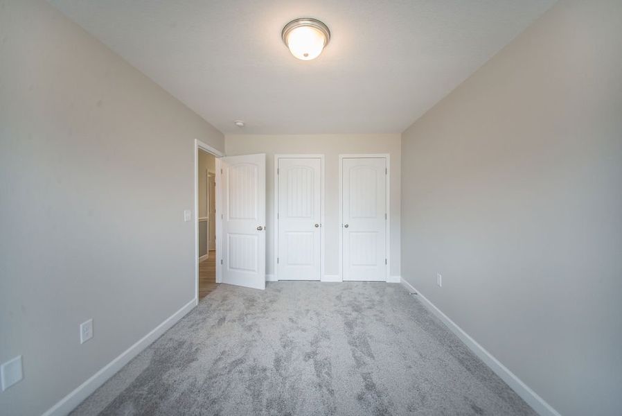 Representative unfurnished interior of a home built from the Quincy by Enchanted Homes in Hampshire Heights, Moore (Image 24).