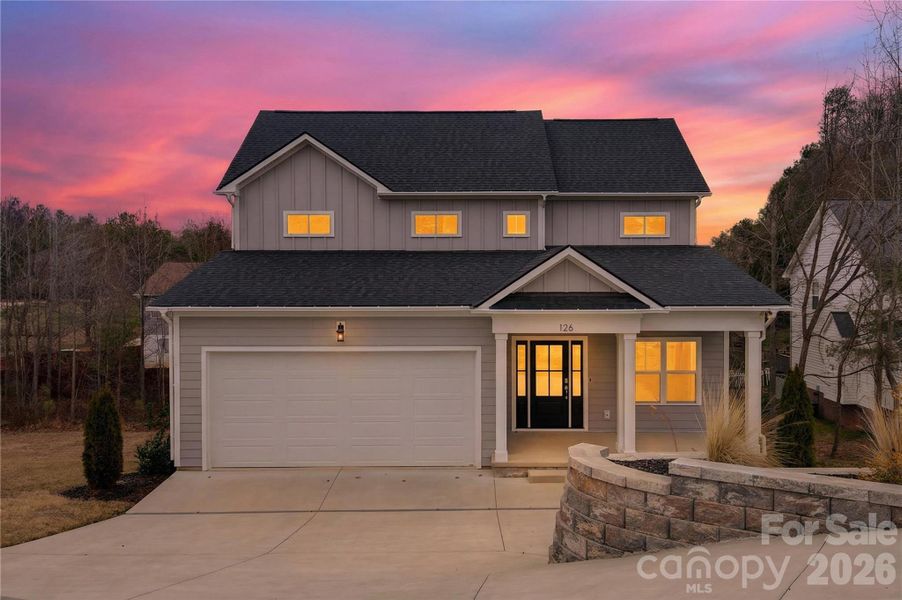 Front exterior of a new home in , Troutman, NC, highlighting curb appeal (Image 14).