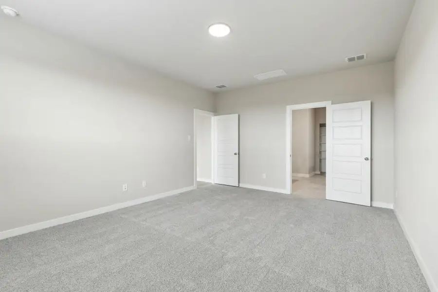 Primary Suite in the Winters home plan by Trophy Signature Homes – REPRESENTATIVE PHOTO
