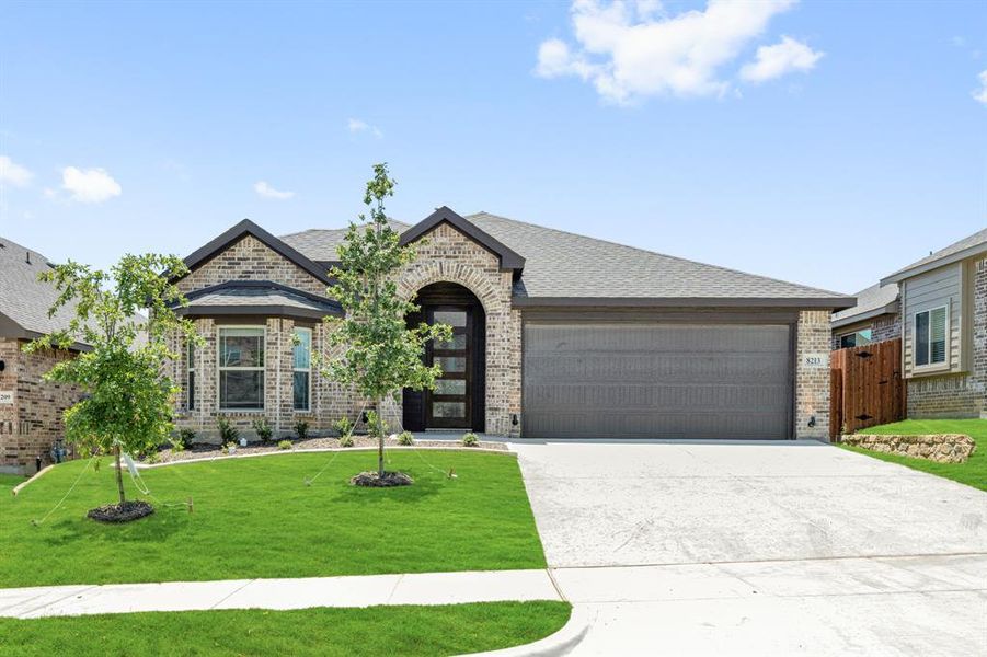 Front exterior of a new home in Godley Ranch Elements, Godley, TX, highlighting curb appeal (Image 2). Front exterior of a new home in Godley Ranch Elements, Godley, TX, highlighting curb appeal (Image 2).
