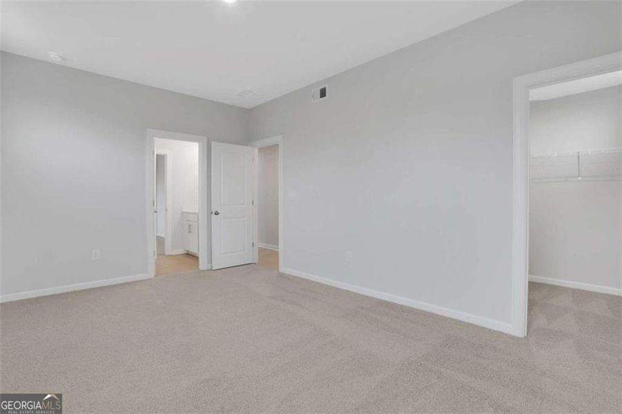 Spacious, unfurnished interior of a new home in The Paddocks at Doc Hughes, Buford (Image 50).