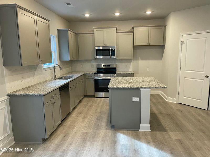 Furnished interior view inside a new home in Mill Creek Cove, Bolivia (Image 5).