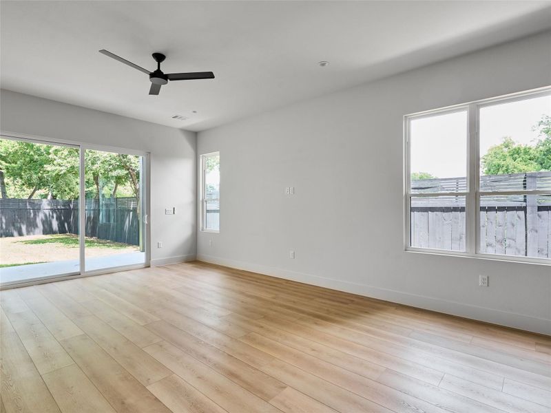 Empty room featuring ceiling fan and light wood-style flooring Empty room featuring ceiling fan and light wood-style flooring