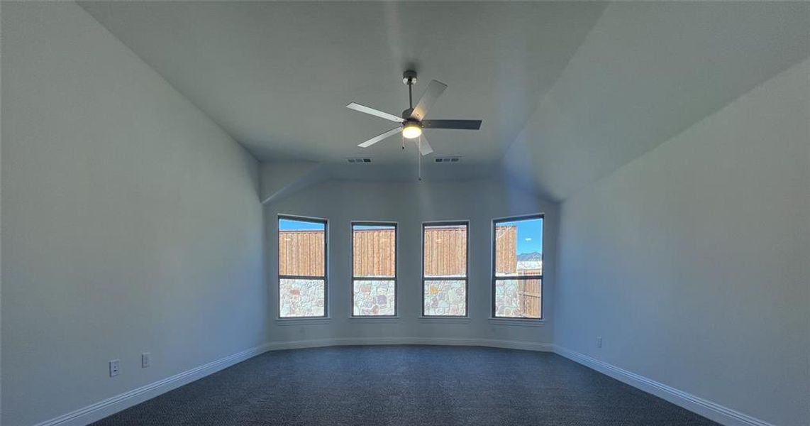 Primary Bedroom featuring ceiling fan, visible vents, and baseboards