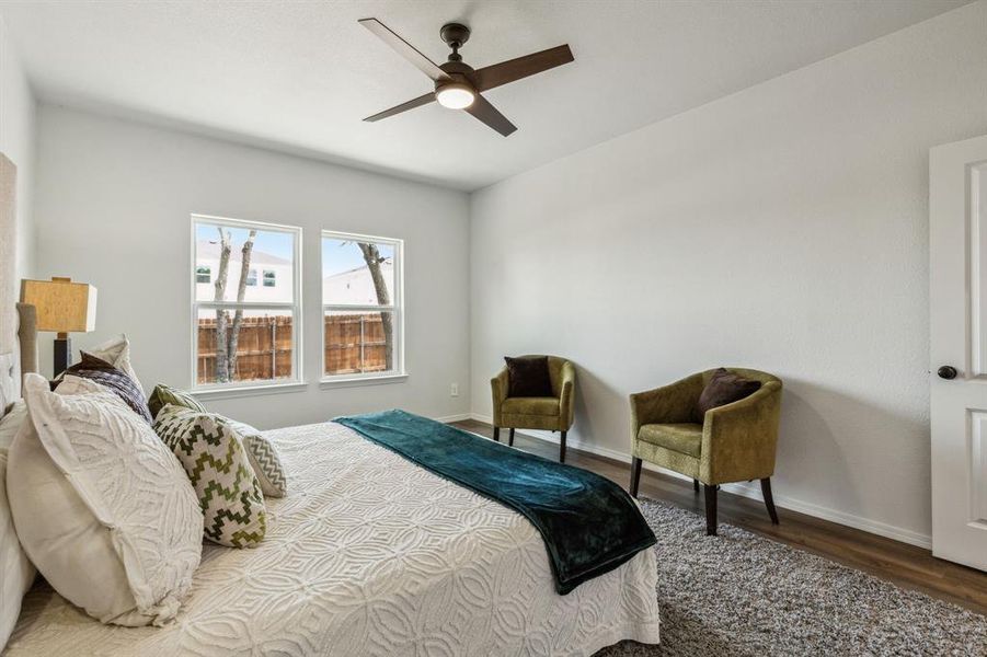 Bedroom featuring hardwood / wood-style floors and ceiling fan