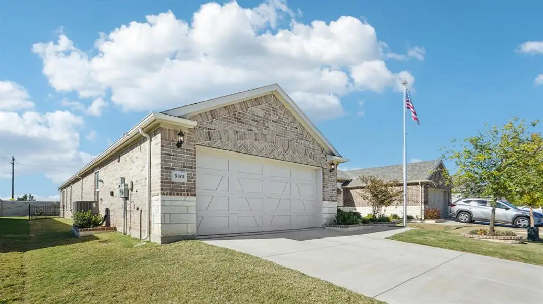 View of front of property featuring brick siding, a front yard, concrete driveway, and an attached garage View of front of property featuring brick siding, a front yard, concrete driveway, and an attached garage