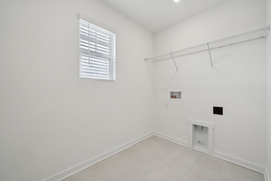 A white room with a window.