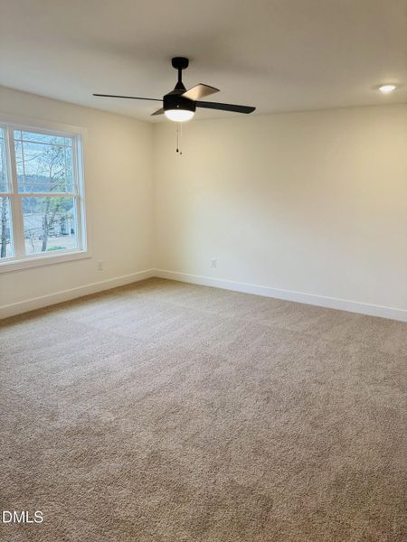 primary bedroom w ceiling fan 1