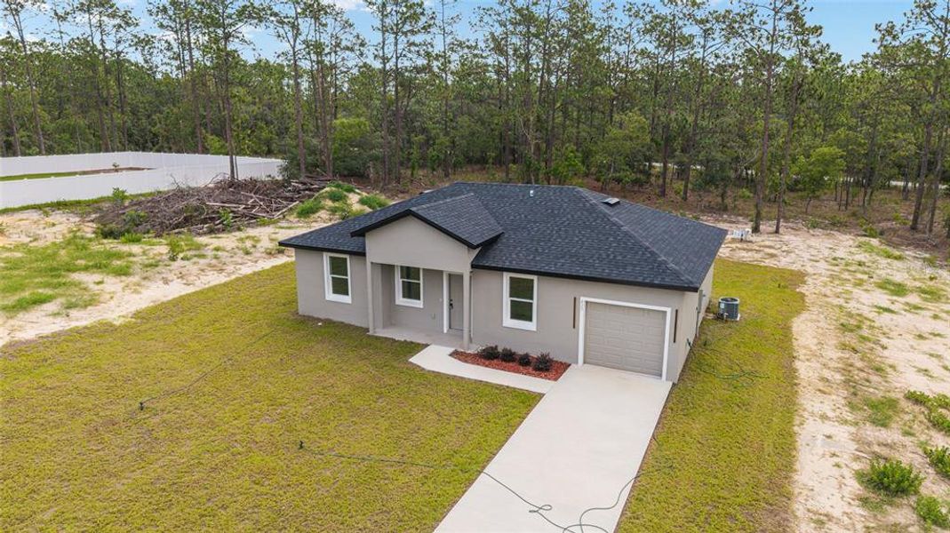 Front exterior of a new home in , Dunnellon, FL, highlighting curb appeal (Image 17). Front exterior of a new home in , Dunnellon, FL, highlighting curb appeal (Image 17).