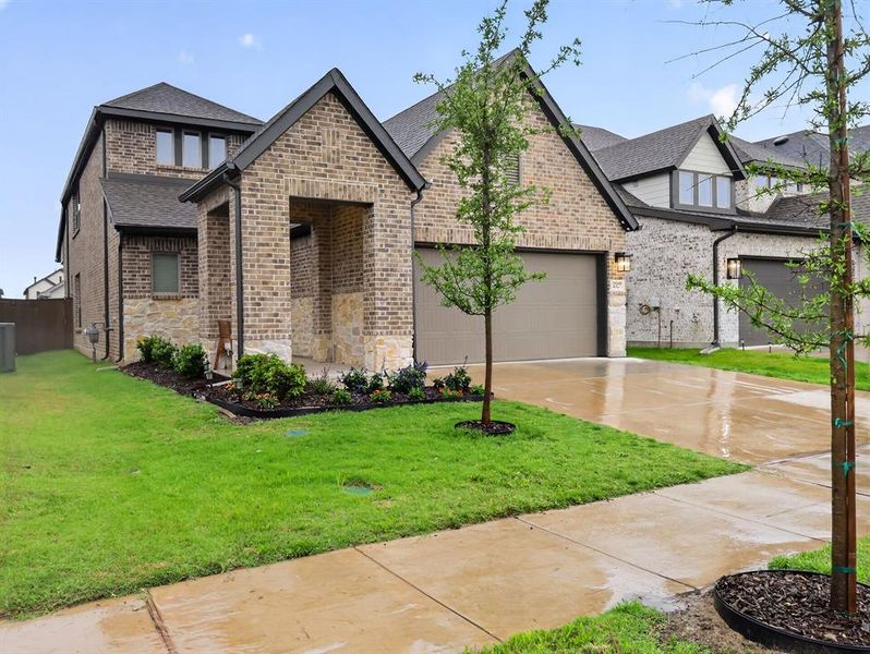 Front exterior of a new home in , Royse City, TX, highlighting curb appeal (Image 1). Front exterior of a new home in , Royse City, TX, highlighting curb appeal (Image 1).