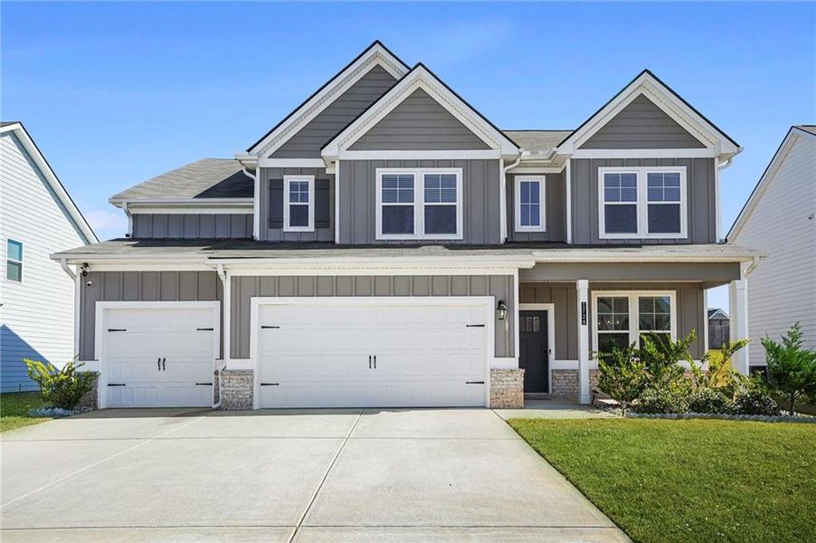 Front exterior of a new home in Berkeley Lakes, Locust Grove, GA, highlighting curb appeal (Image 27).