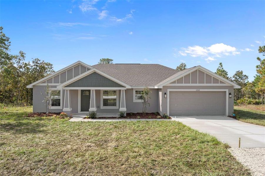 Front exterior of a new home in , Weeki Wachee, FL, highlighting curb appeal (Image 24). Front exterior of a new home in , Weeki Wachee, FL, highlighting curb appeal (Image 24).