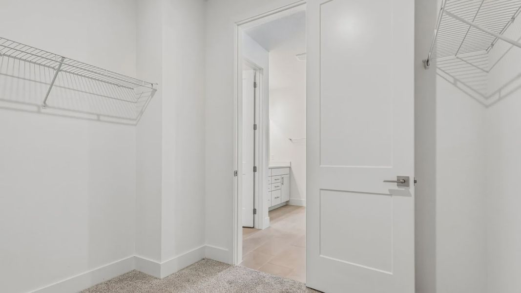 Longleaf Primary Suite Bath Walk-in Closet by DRB Homes in Trailside New Homes in Mount Dora FL