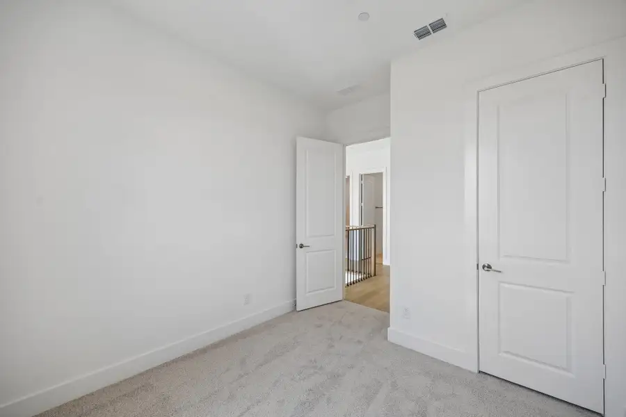 Spacious, unfurnished interior of a new home in Newman Village Townhomes, Frisco (Image 32).