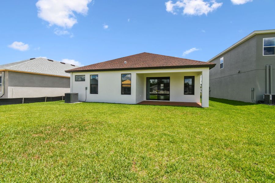 Front exterior of a new home in Avalon West, Spring Hill, FL, highlighting curb appeal (Image 58).