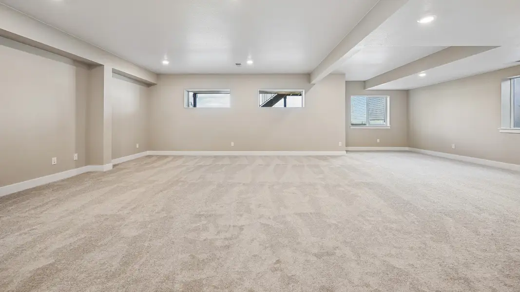 Finished basement with an open layout and room for entertaining or spending time with friends and family
