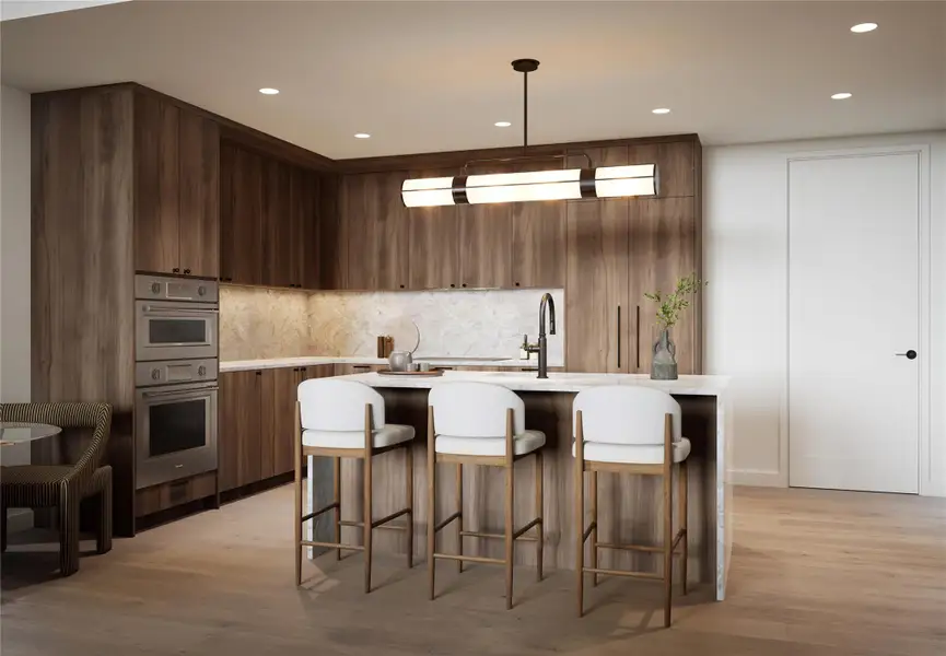 Kitchen with a breakfast bar, hanging light fixtures, wood finished floors, recessed lighting, quartzite countertop and Thermador appliances. Trailhead Palette