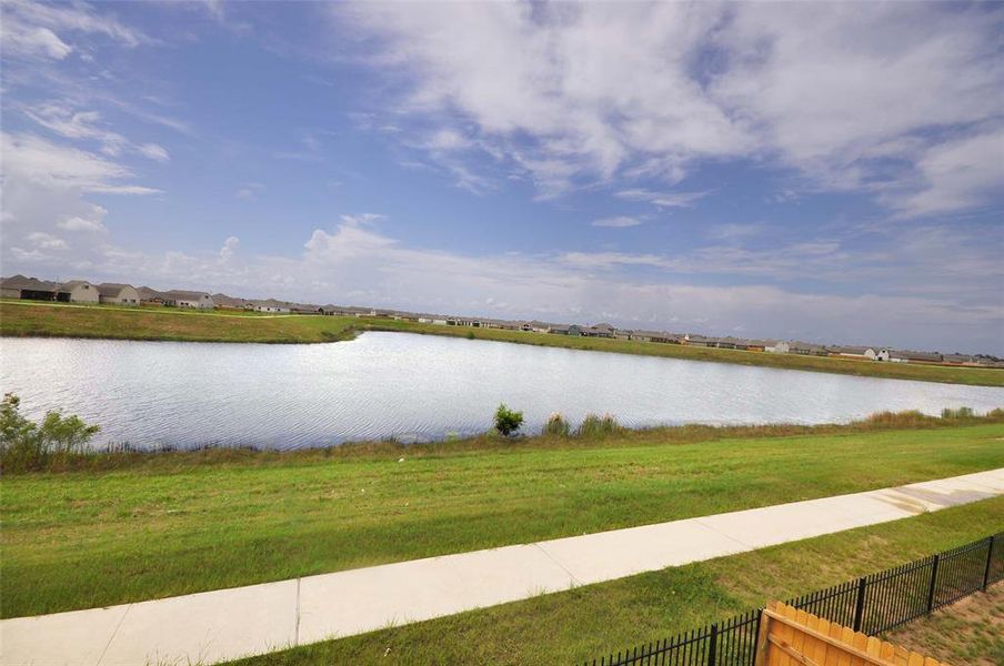 Enter the walking trail through gate in the rear fence and enjoy a brick walk to start your day.