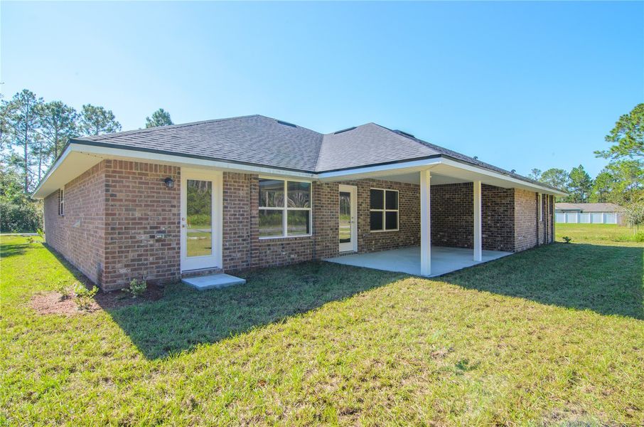 Exterior details and patio area of a home in Palm Coast, Palm Coast (Image 25).